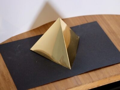 Platonic solid tetrahedron gold on black